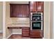 Gourmet kitchen with stainless steel appliances, granite countertops, and a built in oven at 30488 N 126Th Dr, Peoria, AZ 85383