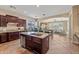 Gourmet kitchen with granite countertops, stainless steel appliances, and dark wood cabinets at 30488 N 126Th Dr, Peoria, AZ 85383