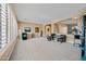 Expansive living area with plush carpeting, shuttered windows and lots of room to relax at 30488 N 126Th Dr, Peoria, AZ 85383