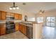 Bright kitchen features stainless steel appliances, a breakfast bar, and an open floor plan at 320 N 168Th Dr, Goodyear, AZ 85338