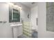 Bright bathroom with pedestal sink, glass block detail, and modern fixtures at 3655 N 5Th Ave # 213, Phoenix, AZ 85013