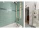 Bathroom with tiled shower, glass block detail, and built-in shelving at 3655 N 5Th Ave # 213, Phoenix, AZ 85013