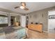 Serene bedroom offers wood floors, mirrored closet, ceiling fan, a cityscape wall art piece and a dresser at 3655 N 5Th Ave # 213, Phoenix, AZ 85013