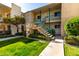 Exterior shot of apartment complex featuring well-manicured lawn and stairs at 3655 N 5Th Ave # 213, Phoenix, AZ 85013