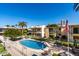 Aerial view of pool and apartment complex on a bright, sunny day at 3655 N 5Th Ave # 213, Phoenix, AZ 85013