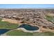 Community aerial view showcasing golf course, lakes, and community center at 3746 E Vallejo Dr, Gilbert, AZ 85298