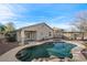 Inviting backyard pool and patio area, perfect for outdoor enjoyment, set against blue sky at 3746 E Vallejo Dr, Gilbert, AZ 85298