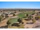 Beautiful aerial view of the golf course and mountain backdrop at 3746 E Vallejo Dr, Gilbert, AZ 85298