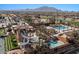 Resort-style pool with water slide and pergola-covered seating areas overlooking the golf course at 3746 E Vallejo Dr, Gilbert, AZ 85298