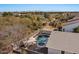 Private backyard pool and spa with rock waterfall feature and covered patio area at 3746 E Vallejo Dr, Gilbert, AZ 85298