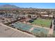 Aerial view of the community tennis and sports courts with parking and open seating area at 3746 E Vallejo Dr, Gilbert, AZ 85298