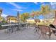 Outdoor dining area with a large table and chairs, alongside a cozy seating area perfect for entertaining guests at 3906 N 297Th Cir, Buckeye, AZ 85396