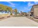 Spacious backyard featuring a basketball court, a ' play area, and a covered patio with a pergola at 3906 N 297Th Cir, Buckeye, AZ 85396