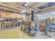 Organized garage space with cabinets, a workbench, a punching bag, and plenty of storage at 3906 N 297Th Cir, Buckeye, AZ 85396