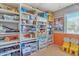 Versatile spare bedroom with wall-to-wall shelving and a window at 3906 N 297Th Cir, Buckeye, AZ 85396