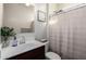 Bathroom featuring a vanity with a white sink and a shower with curtain at 3923 S 244Th Dr, Buckeye, AZ 85326