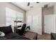 Bedroom with a ceiling fan, carpet, and a sliding-door closet at 3923 S 244Th Dr, Buckeye, AZ 85326