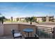 Relaxing balcony with views of the neighborhood and comfortable outdoor seating at 4931 N Woodmere Fairway -- # 1001, Scottsdale, AZ 85251