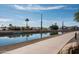 Scenic canal walkway surrounded by greenery, creating a peaceful ambiance at 4931 N Woodmere Fairway -- # 1001, Scottsdale, AZ 85251