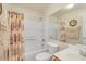 Full bathroom with a shower and tub combination, framed by a floral shower curtain at 537 S Delaware Dr # 115, Apache Junction, AZ 85120