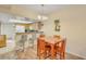 Eat-in kitchen with a dining table for four and breakfast bar seating at 537 S Delaware Dr # 115, Apache Junction, AZ 85120