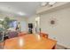 Inviting living room with wooden dining table and views to the front door at 537 S Delaware Dr # 115, Apache Junction, AZ 85120