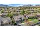 Scenic aerial view of the residence nestled in a vibrant neighborhood with mountain backdrop at 5507 E Shea Blvd, Scottsdale, AZ 85254