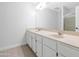 Spacious bathroom featuring dual sinks, a large mirror, and a separate shower area at 5507 E Shea Blvd, Scottsdale, AZ 85254