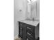 Elegant bathroom vanity with marble countertop, dark cabinetry, and stylish fixtures at 5507 E Shea Blvd, Scottsdale, AZ 85254