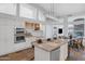 Modern kitchen with stainless steel appliances and a large island with seating at 5507 E Shea Blvd, Scottsdale, AZ 85254