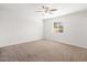 Bright bedroom featuring a ceiling fan and a window, offering natural light, creating a comfortable living space at 5919 W Villa St, Phoenix, AZ 85043