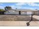 Charming single-story home with a well-maintained desert landscape at 5919 W Villa St, Phoenix, AZ 85043