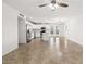 Bright living room with modern kitchen, tile floors, and doors leading to the outdoor area at 5919 W Villa St, Phoenix, AZ 85043