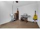 Bonus room with guitars, a keyboard, and white brick walls at 6329 E Dodge St, Mesa, AZ 85205