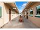 Outdoor hallway with multiple activity rooms including computer, library, ceramics, and fused glass at 6329 E Dodge St, Mesa, AZ 85205