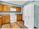 Well-lit kitchen featuring wooden cabinets, modern appliances, and a clean, functional design at 6329 E Dodge St, Mesa, AZ 85205