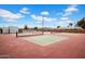 Community pickleball court featuring a well-maintained surface and surrounding privacy fencing at 6329 E Dodge St, Mesa, AZ 85205