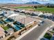 Aerial shot showcasing luxury backyard pools with lush greenery, outdoor seating, and mountain views for relaxing outdoor living at 6336 S Granite St, Gilbert, AZ 85298