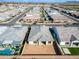 Aerial view of the house highlighting the backyard, roof, and community with streets and other homes at 6336 S Granite St, Gilbert, AZ 85298