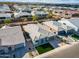 Aerial view of a house showcasing a green lawn, roof and close proximity to neighboring homes at 6336 S Granite St, Gilbert, AZ 85298