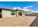 Bare backyard, ready to landscape, with a covered patio and views of neighboring homes at 6336 S Granite St, Gilbert, AZ 85298