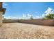 View of spacious, unlandscaped backyard with block wall, perfect for customization at 6336 S Granite St, Gilbert, AZ 85298