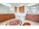 Elegant bathroom with dual sinks, soaking tub, and modern fixtures at 6336 S Granite St, Gilbert, AZ 85298