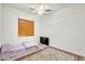 Cozy bedroom with a ceiling fan and an area rug that adds a touch of elegance at 6336 S Granite St, Gilbert, AZ 85298