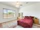 Spacious bedroom featuring a ceiling fan, window, and traditional furnishings at 6336 S Granite St, Gilbert, AZ 85298