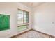 Bright bedroom featuring a window with blinds, ceiling fan, and soft carpet at 6336 S Granite St, Gilbert, AZ 85298