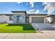 Modern single-story home showcasing its stylish exterior, well-manicured lawn, and a spacious driveway at 6336 S Granite St, Gilbert, AZ 85298