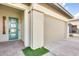 Welcoming entrance with modern door, neutral siding, paver walkway, and attached two car garage at 6336 S Granite St, Gilbert, AZ 85298