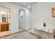 Hallway featuring neutral walls and a view of the bathroom with granite countertops at 6336 S Granite St, Gilbert, AZ 85298