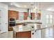 Modern kitchen with a center island, stainless steel appliances, and stylish pendant lighting at 6336 S Granite St, Gilbert, AZ 85298